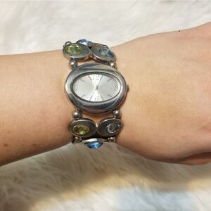 Silver watch with blue/green stones